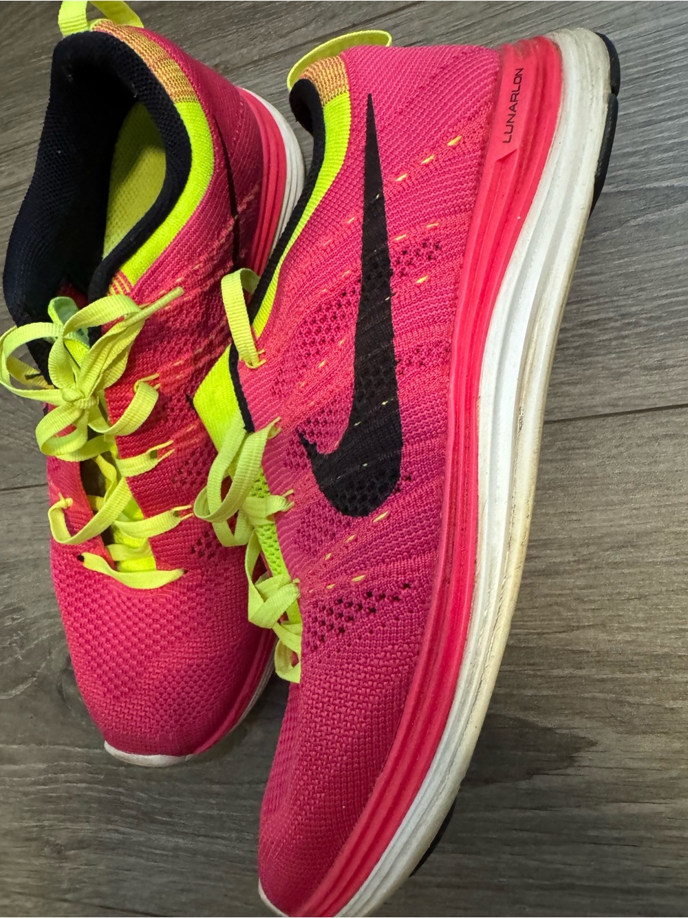Nike Women’s Hot Pink & Neon Yellow Flyknit Running Sneakers - Picture 2 of 3